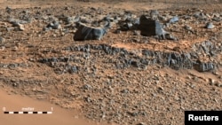 A color mosaic taken by NASA's Mars Curiosity rover Mast Camera (mastcam) shows strata exposed along the margins of the valleys in the "Pahrump Hills" region on Mars in this undated handout photo courtesy of NASA.