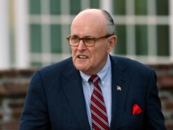 FILE - Former New York Mayor Rudy Giuliani arrives at the Trump National Golf Club Bedminster clubhouse in Bedminster, N.J., Nov. 20, 2016.