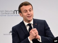 French President Emmanuel Macron gestures on the second day of the Munich Security Conference in Munich, Germany, Feb. 15, 2020.