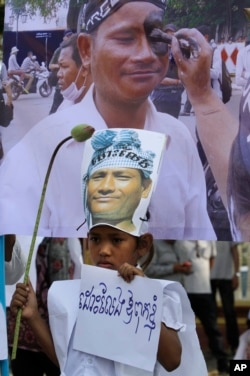 A nine-year-old daughter of detained Chan Puthisak holds a banner reading "Free my father" as she joins villagers during a protest rally in front of Ministry of Justice in Phnom Penh, Cambodia, Monday, Feb. 10, 2014.