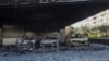 Burned-out cars remain in an open garage following the recent wave of violence between Syrian security forces and gunmen loyal to former President Bashar Assad, as well as subsequent sectarian attacks, Jableh, Syria, March 10, 2025.