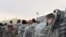 (FILES) US army soldiers queue to board a plane to begin their journey home out of Iraq from the al-Asad Air Base west the capital Baghdad, on November 1, 2011.