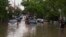 FILE - Cars are towed on a flooded street in Montreal, Quebec, May 29, 2012. Heavy rains early this week have flooded towns in several areas across the predominately French-language province.