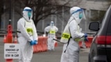 During the coronavirus pandemic, many resources were spread very thin. Pictured here, medical workers screen people arriving at a special COVID-19 testing site in Boston, Saturday, March 28, 2020. (AP Photo/Michael Dwyer)