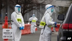 During the coronavirus pandemic, many resources were spread very thin. Pictured here, medical workers screen people arriving at a special COVID-19 testing site in Boston, Saturday, March 28, 2020. (AP Photo/Michael Dwyer)