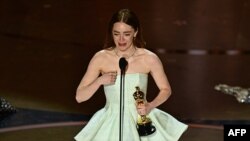 US actress Emma Stone accepts the award for Best Actress in a Leading Role for "Poor Things" onstage during the 96th Annual Academy Awards at the Dolby Theatre in Hollywood, California on March 10, 2024.