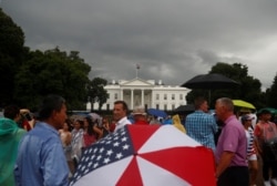 People gather in front of the White House during a Fourth of July Independence Day protest in Washington, D.C., July 4, 2019.