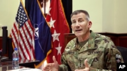 Head of NATO and U.S. forces in Afghanistan, U.S. Army Gen. John W. Nicholson, speaks during an interview with The Associated Press at his office, in Kabul, Afghanistan, July 27, 2016.