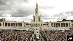 FILE - Pope Francis departs Mass at which he canonized shepherd children Jacinta and Francisco Marto at the Sanctuary of Our Lady of Fatima, May 13, 2017, in Fatima, Portugal.