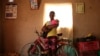 FILE - Virginia Mavhunga, a 13-year-old teenage mother, holds her child at her home in Murehwa, 80 kilometres (50 miles) northeast of Zimbabwe's capital Harare, Saturday, Dec. 11, 2021. 