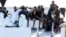 FILE - Migrants wait to disembark from the Italian coast guard vessel "Diciotti" at the port of Catania, Italy, Aug. 22, 2018.