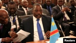 FILE - Democratic Republic of Congo's President Joseph Kabila attends a two-day meeting of leaders from the Southern African Development Community (SADC) in Pretoria, Nov. 4, 2013.