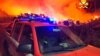 Italijanski vatrogasci i požar nedaleko od Mandasa, na fotografiji koju su napravili vatrogasci, na jugu Sardinije, Italija, 12. avgusta 2021.