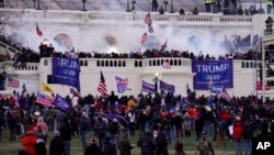 FILE - Violent rioters loyal to President Donald Trump storm the Capitol in Washington on Jan. 6, 2021. 