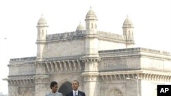 U.S. President Barack Obama and first lady Michelle Obama make a statement after their visit the memorial for the Nov. 26, 2008 terror attack victims at the Taj Mahal Palace and Tower Hotel in Mumbai, 06 Nov 2010