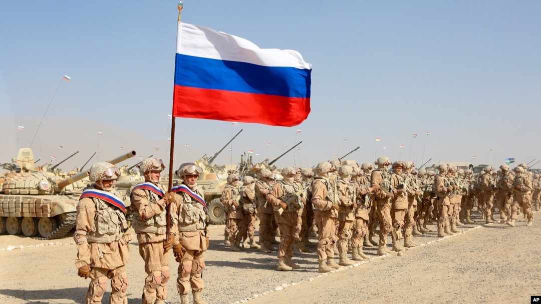 FILE - Russian troops line up before the start of joint military drills with Tajikistan and Uzbekistan at the Harb-Maidon firing range about 20 kilometers north of the Tajik border with Afghanistan, in Tajikistan, Aug. 10, 2021.