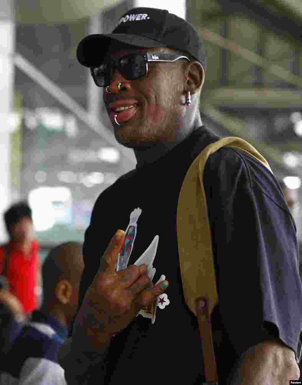 Dennis Rodman tiba untuk transit di Bandara Internasional Beijing Capital, Selasa (3/9).