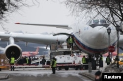 FILE - The Ilyushin Il-96 aircraft, transporting expelled Russian diplomats and their family members from the U.S., is seen shortly after landing at Vnukovo airport outside Moscow, Russia, April 1, 2018.