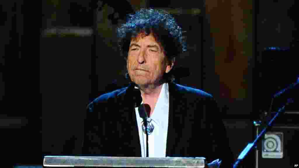 FILE - Bob Dylan accepts the 2015 MusiCares Person of the Year award at the 2015 MusiCares Person of the Year show in Los Angeles, Feb. 6, 2015.