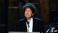 FILE - Bob Dylan accepts the 2015 MusiCares Person of the Year award at the 2015 MusiCares Person of the Year show in Los Angeles, Feb. 6, 2015.