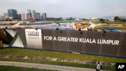 FILE - This May 9, 2015, photo shows state investment fund 1Malaysia Development Berhad's Tun Razak Exchange development in Kuala Lumpur, Malaysia.