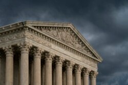 FILE - The Supreme Court building is seen under stormy skies in Washington, June 20, 2019.