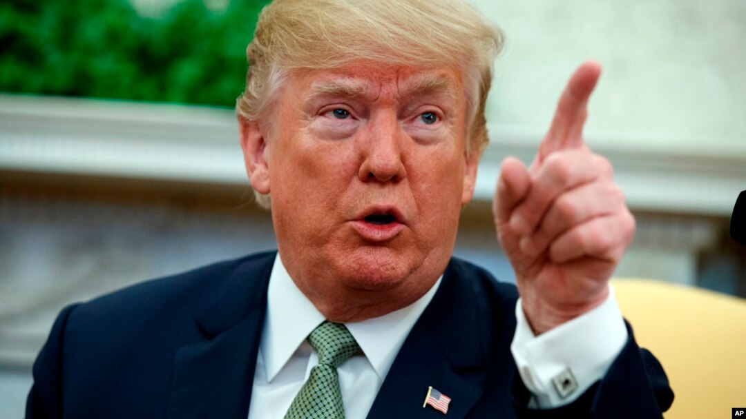 FILE - President Donald Trump talks with reporters in the Oval Office of the White House in Washington, March 15, 2018. Getting wise to his staff's stall tactics and attempts to steer him to their favored options, Trump now increasingly follows his own instincts.