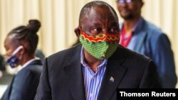 FILE PHOTO: South African President Cyril Ramaphosa visits the coronavirus disease (COVID-19) treatment facilities in Johannesburg