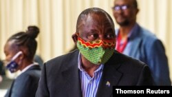 FILE PHOTO: South African President Cyril Ramaphosa visits the coronavirus disease (COVID-19) treatment facilities in Johannesburg