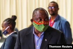 FILE - South African President Cyril Ramaphosa visits the coronavirus disease (COVID-19) treatment facilities in Johannesburg