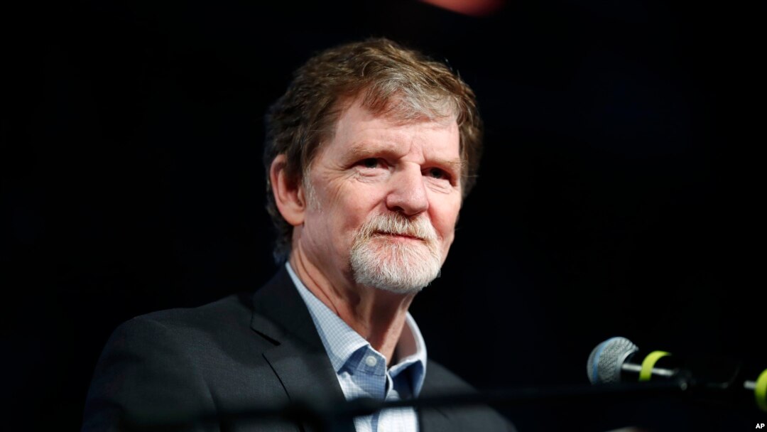 FILE - Jack Phillips, owner of Masterpiece Cake, speaks during a rally on the campus of a Christian college in Lakewood, Colo., Nov. 8, 2017.