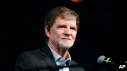 FILE - Jack Phillips, owner of Masterpiece Cake, speaks during a rally on the campus of a Christian college in Lakewood, Colo., Nov. 8, 2017.