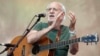 FILE - Singer-songwriter Peter Yarrow, of the 1960s era musical trio Peter, Paul and Mary, performs during a memorial tribute concert for folk icon and civil rights activist Pete Seeger in New York on July 20, 2014.