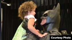 FILE - "Batman" (Lenny Robinson) visiting sick children throughout the Maryland region. (Photo: Superheros for Kids)