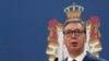 Serbia's president says he won't flee his country like Syria's Assad did despite growing protests