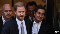 FILE - Prince Harry and attorney David Sherborne leave Britain's High Court in London on June 7, 2023. Sherborne read a statement in court on Jan. 22, 2025, saying Rupert Murdoch's News Group offers a "full and unequivocal apology" for unlawful intrusion on Harry's privacy.