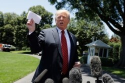 President Donald Trump speaks to reporters before departing for a trip to Iowa, on the South Lawn of White House, June 11, 2019.