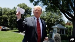 President Donald Trump speaks to reporters before departing for a trip to Iowa, on the South Lawn of White House.