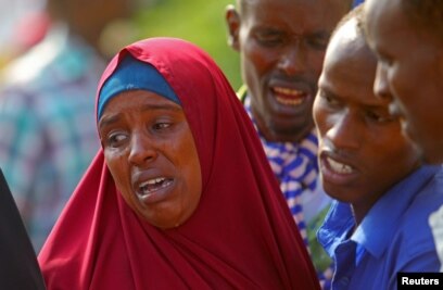 Relatives mourn family members killed in an attack by Somali forces and supported by U.S. troops, at Madina hospital in Mogadishu, Somalia, Aug. 25, 2017.