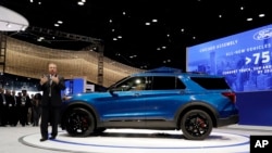 Joe Hinrichs, Ford's president of global operations of the Americas for Ford Motor Company, speaks during the media preview of the Chicago Auto Show at McCormick Place, Feb. 7, 2019, in Chicago.