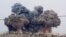 FILE - In this image made from video provided by Hadi Al-Abdallah, which has been verified and is consistent with other AP reporting, smoke rises after airstrikes in Kafr Nabel of the Idlib province, western Syria, Oct. 1, 2015. 
