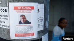 A flyer showing Venezuelan opposition leader Edmundo Gonzalez is attached to a pole, while the Venezuelan government is offering a reward for information leading to his arrest, in Caracas, Venezuela, Jan. 7, 2025.