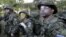 Estonia's Defense League volunteer soldiers attend a training drill near Rabasaare, Estonia, Sept. 12, 2015. 