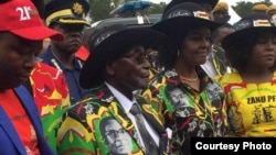 President Robert Mugabe, his wife Grace, daughter Bona and other family members.