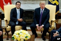 FILE - President Donald Trump speaks during a meeting with Governor Ricardo Rossello of Puerto Rico in the Oval Office of the White House, Oct. 19, 2017.