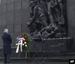 U.S. Secretary of State Rex Tillerson lays a wreath during a ceremony at the Warsaw Ghetto Uprising 1943 memorial marking International Holocaust Remembrance Day, in Warsaw, Poland, Jan. 27, 2018.