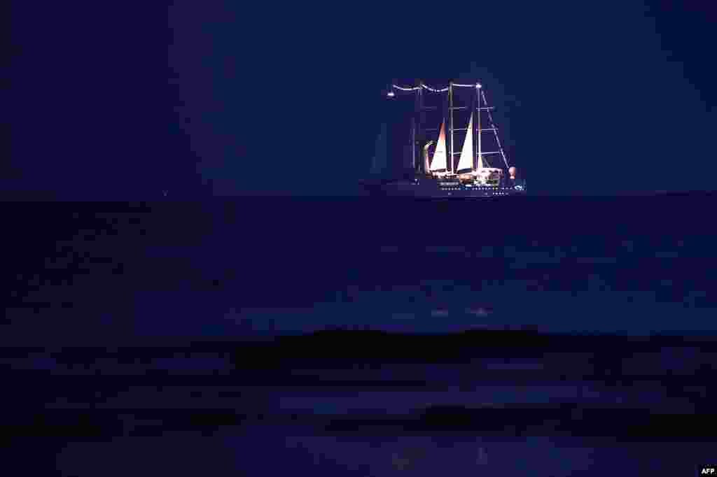 A cruise ship sails some 60 kilometers south of Athens, Greece, Aug. 23, 2014.