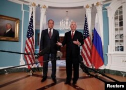 FILE - Secretary of State Rex Tillerson, right, joined by Russian Foreign Minister Sergey Lavrov, speaks to the media at the State Department in Washington, May 10, 2017.