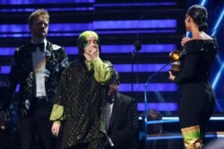 62nd Grammy Awards - Show - Los Angeles, California, U.S., January 26, 2020 - Billie Eilish, with brother and music partner Finneas O'Connell behind her, reacts to winning Record Of The Year for 'Bad Guy.' (REUTERS/Mario Anzuoni)