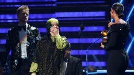 62nd Grammy Awards - Show - Los Angeles, California, U.S., January 26, 2020 - Billie Eilish, with brother and music partner Finneas O'Connell behind her, reacts to winning Record Of The Year for 'Bad Guy.' (REUTERS/Mario Anzuoni)